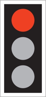 RED means 'Stop'. Wait behind the stop line on the carriageway