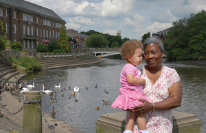 Woman and girl in front of the River Derwent in Derby