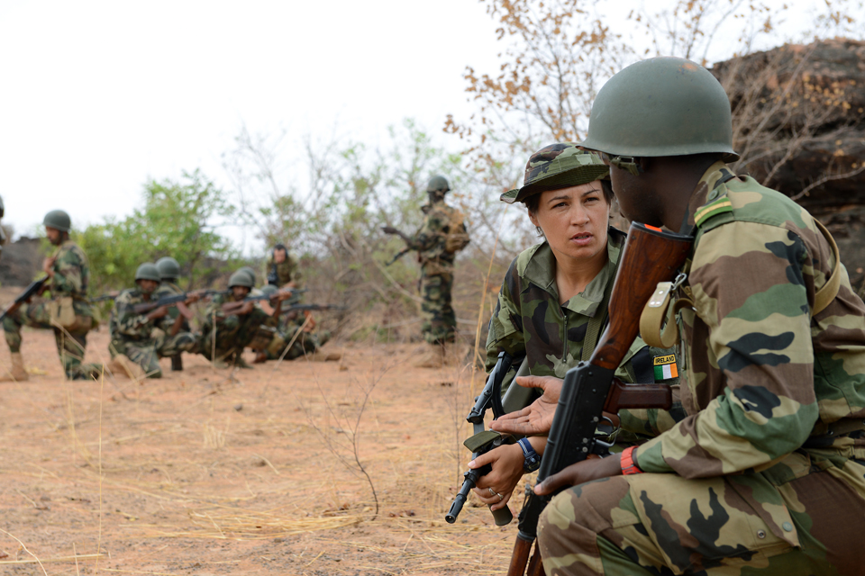 Sergeant Denise English listens to a Mali army platoon commander