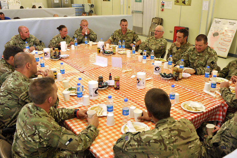 General Wall has supper with a group of soldiers