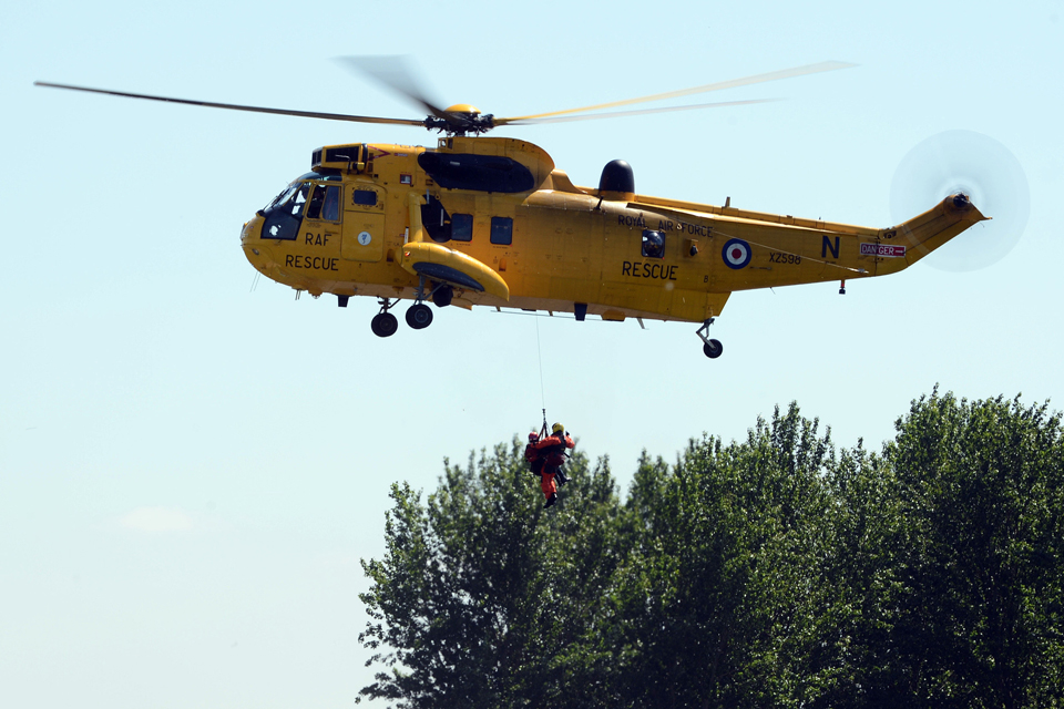 A Royal Air Force Sea King helicopter carries out a river rescue