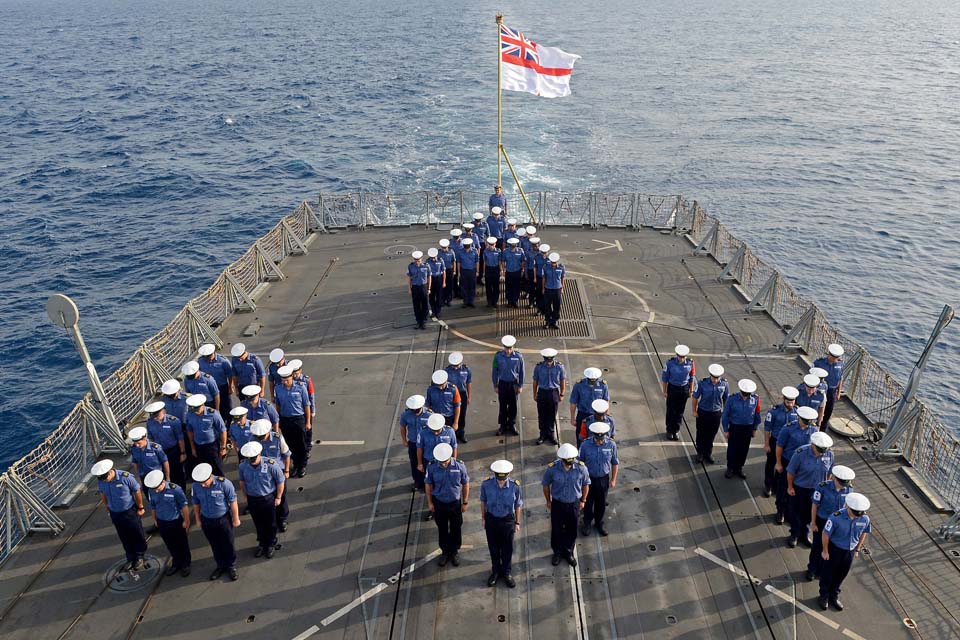 Members of HMS Kent's ship's company celebrate the royal birth