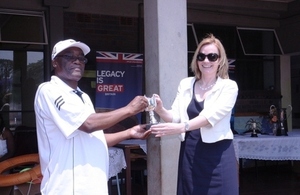 Ambassador Bronnert hands over the Legacy Trophy to St Giles School