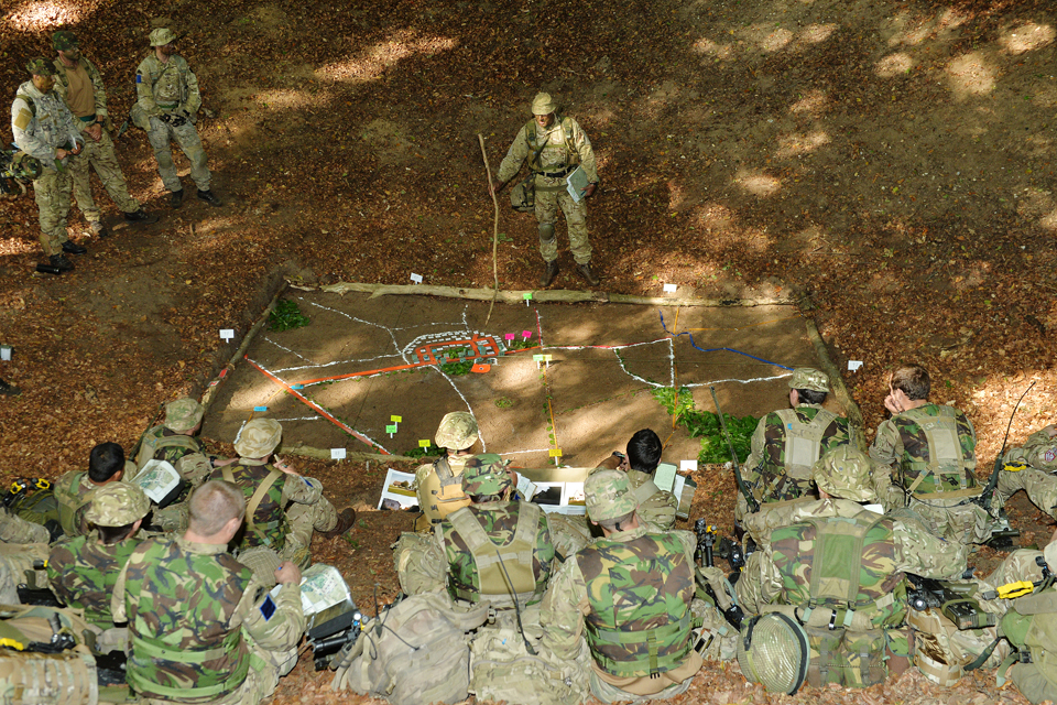 Paratroopers receive a tactical briefing