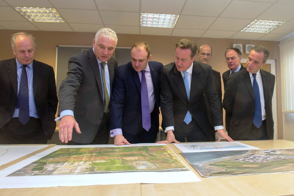 The Prime Minister and Edward Davey, Secretary of State for Energy, view plans for the new nuclear site at Hinkley, Somerset.
