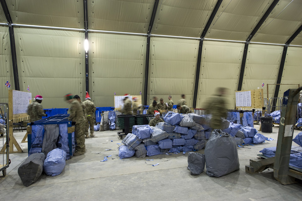 Soldiers sort mail bags