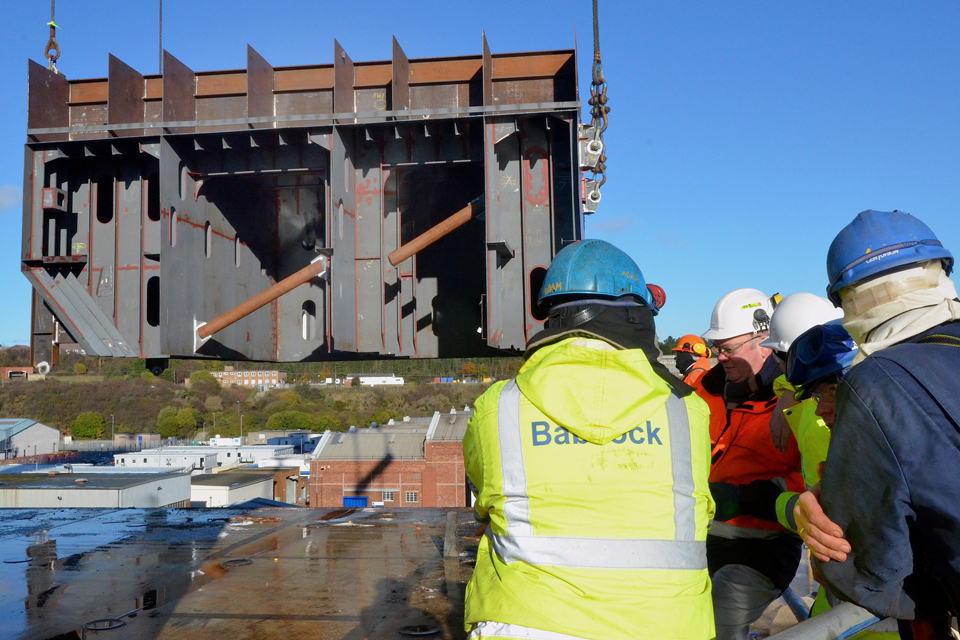 The 300-tonne section of ramp is lifted onto the Queen Elizabeth