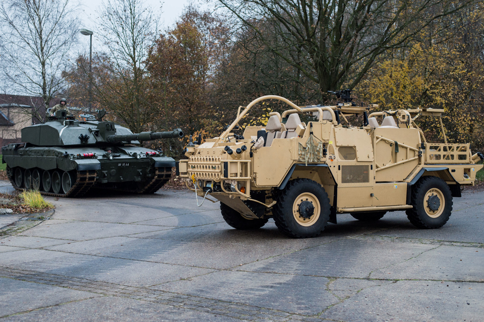 A Challenger 2 main battle tank (left) and a Jackal armoured vehicle 