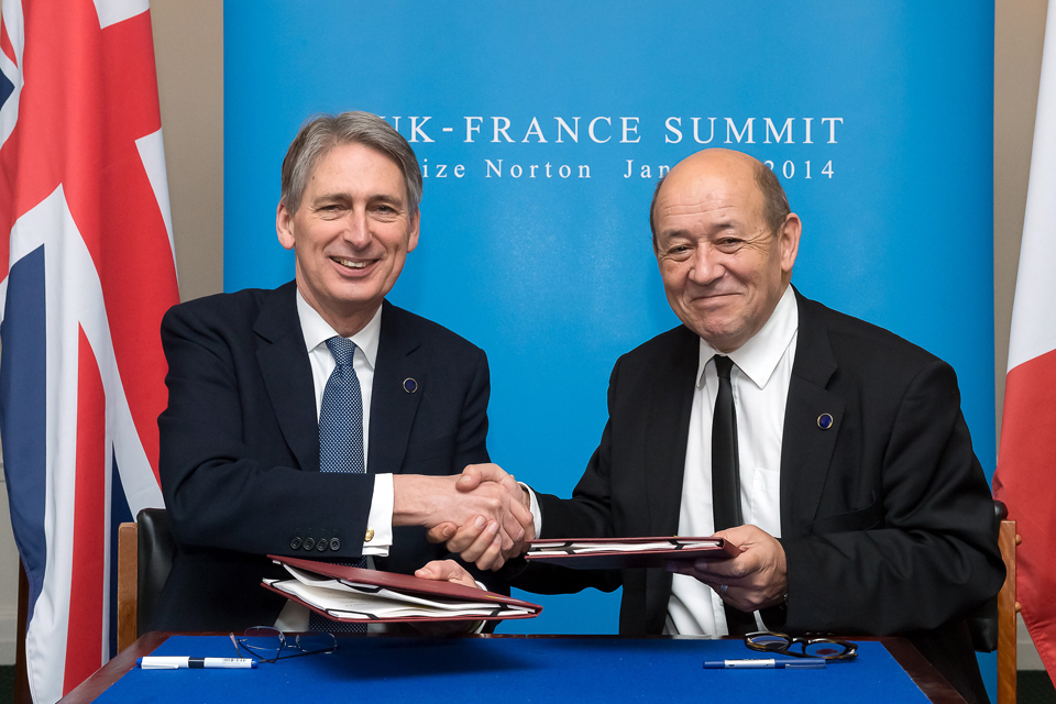 Philip Hammond shakes hands with the French Defence Minister
