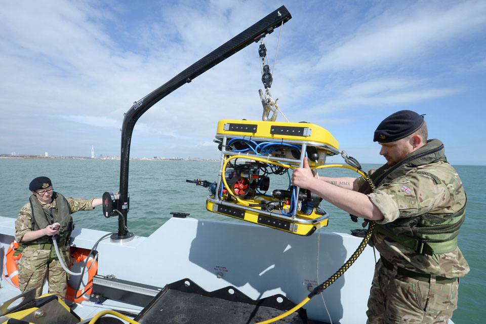 Royal Navy personnel with a submersible mine countermeasures vehicle