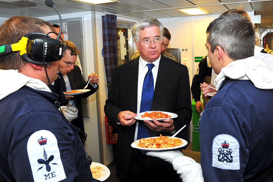 Defence Secretary Michael Fallon eating in the mess on board HMS Duncan