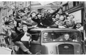 People in a truck celebrating VE Day