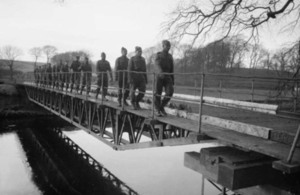 West Indian troops in the Royal Engineers walking across a bridge they had just constructed.