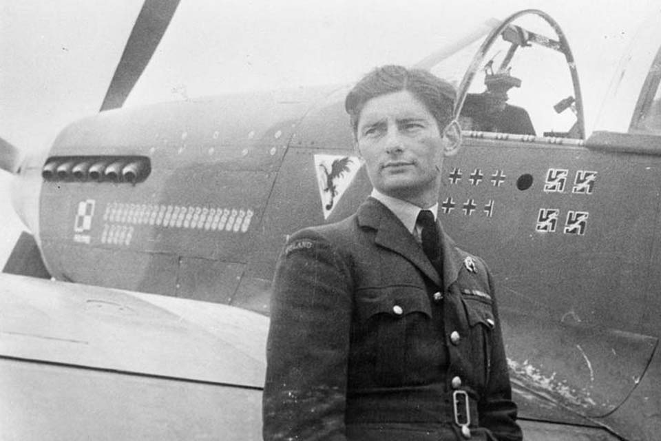 Squadron Leader Eugeniusz Horbaczewski of No. 315 Polish Fighter Squadron, standing by his new Mustang Mark III (FB387, PK-G) at Brenzett, Kent. 