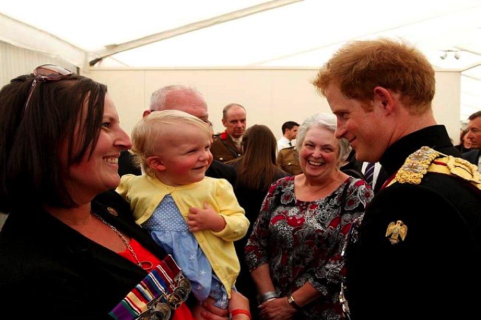 Prince Harry with Tracey and Lainey Walters, wife and daughter of the later Corporal James Walters