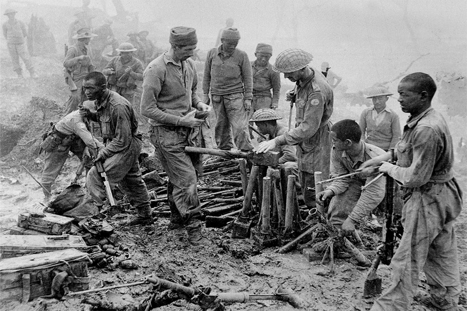 Indian and Gurkha soldiers inspect captured Japanese ordnance during the Imphal-Kohima battle, 1944 (Copyright NAM)