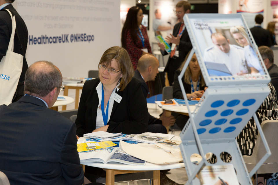 Discussions on the Healthcare UK stand at NHS Expo