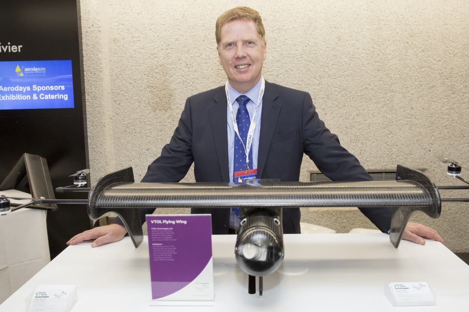 Ashley Bryant, managing director of VTOL Technologies, at his stand exhibiting a wing design at Aerodays 2015.