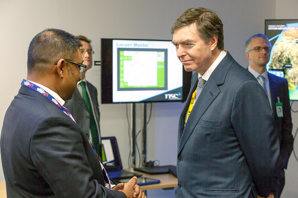 Defence Minister Philip Dunne speaks to Afzal Ali, Capability Development Leader - Synthetics & Intelligent Systems, UK Defence Solutions Centre. 