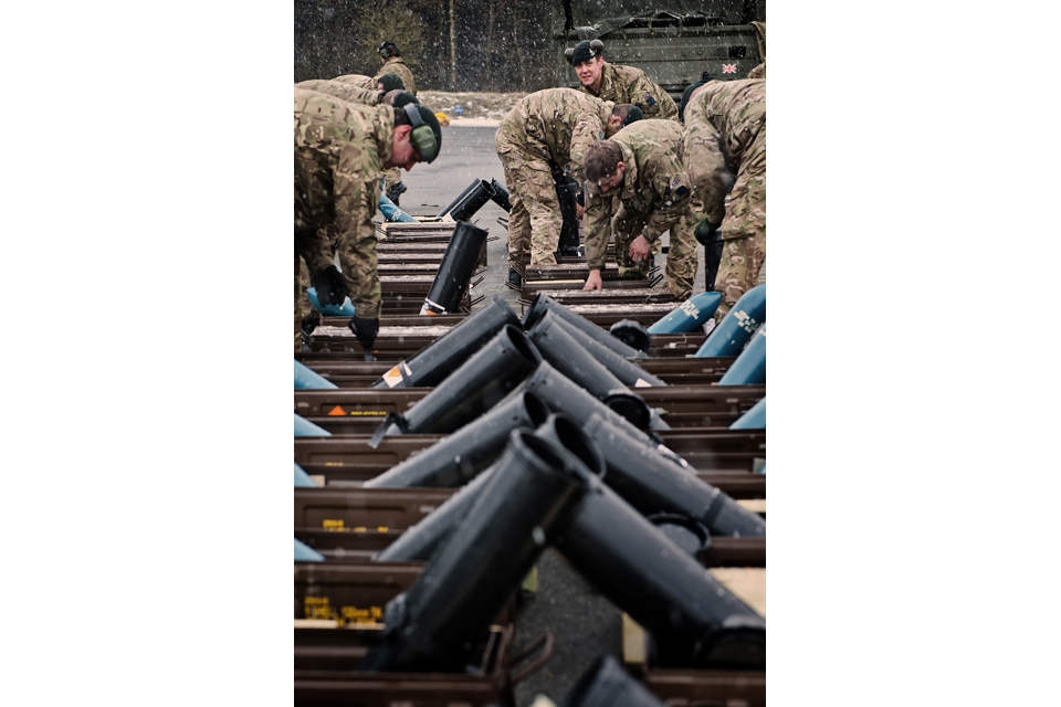 Members of the Queen's Royal Hussars preparing ammunition 