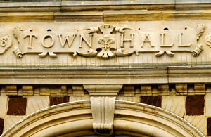 town hall sign on building